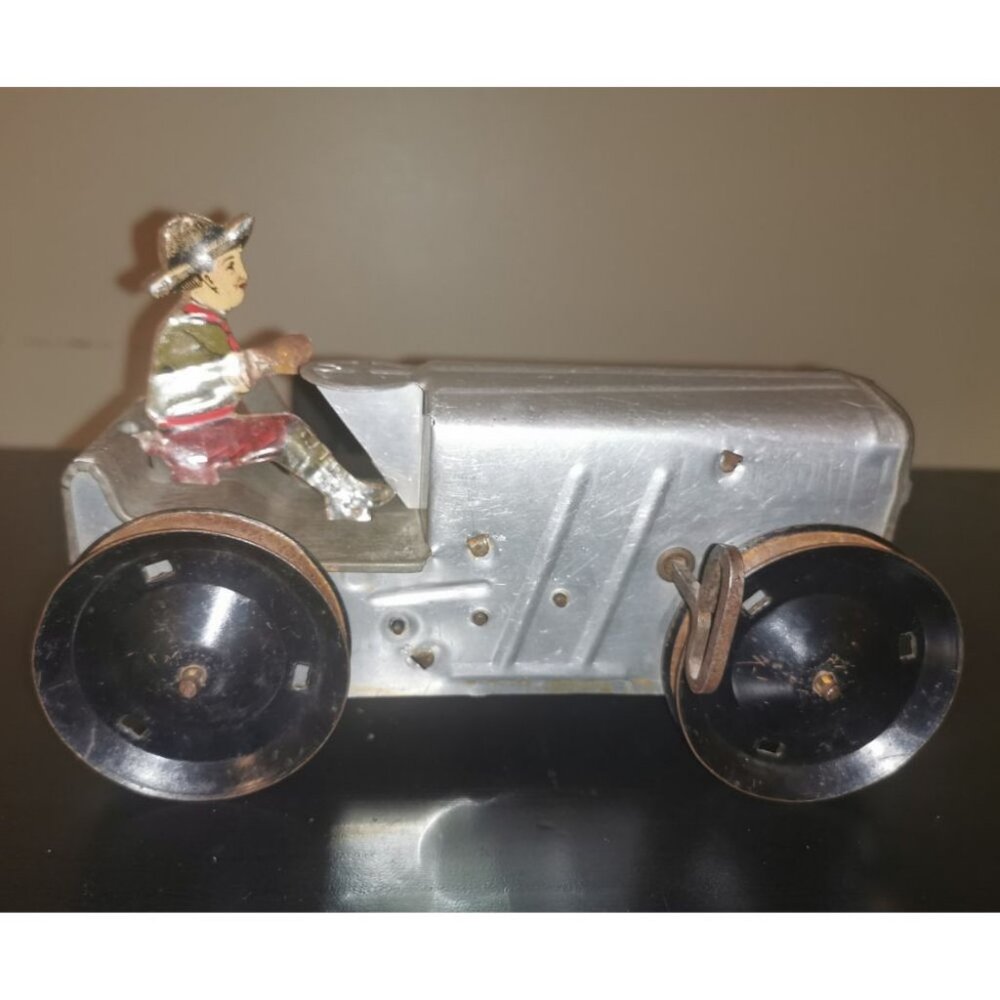 RARE VINTAGE LOUIS MARX WIND-UP ALUMINUM and TIN TRACTOR‎ with LITHO FARMER
